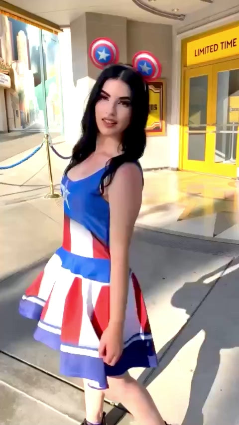 Our model stands outside of the Rogers musical at Disney's California Adventure park wearing a style inspired by Captain Rogers, or Captain America, himself! The dress is a fun red white and blue and makes for great disneybounding, cosplay or an easy all day costume.